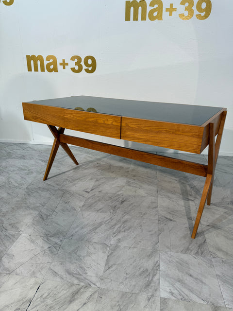 Italian desk with dark green glass top.