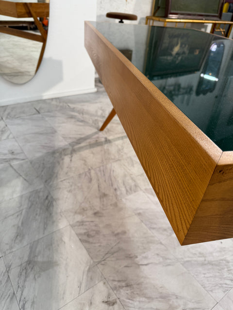 Italian desk with dark green glass top.