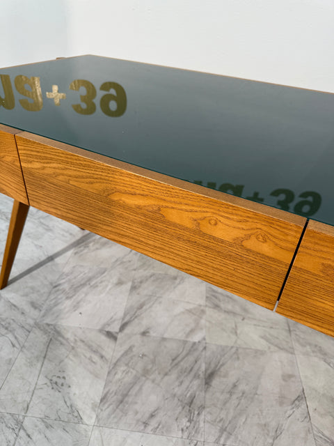 Italian desk with dark green glass top.