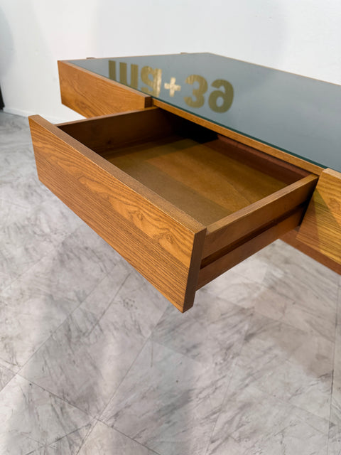 Italian desk with dark green glass top.