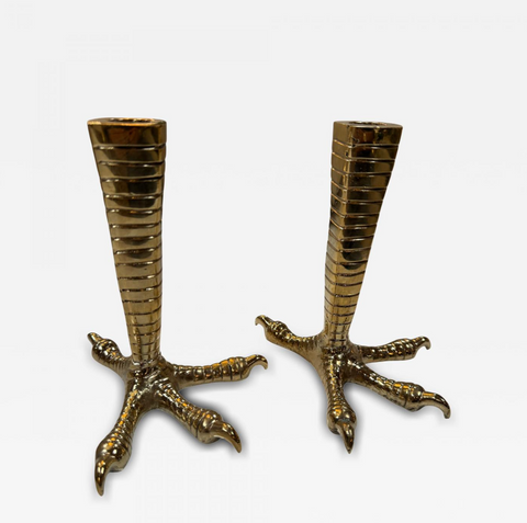 Brass candle holders designed in the shape of bird talons